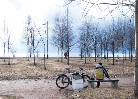 Early Spring in the Park. People walk in the park, ride bicycles.の写真素材