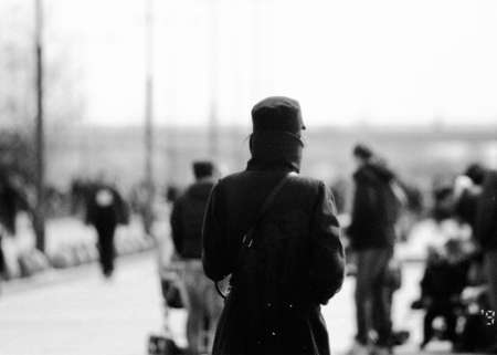 The time traveler. This is the silhouette of a rather unusually dressed man in the park.の写真素材