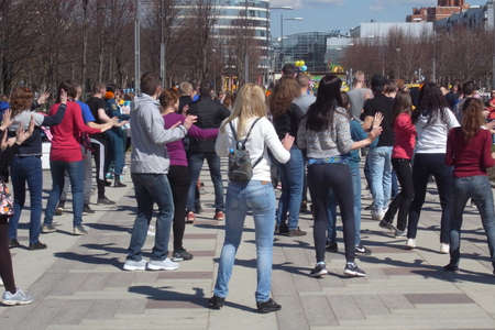 Street dance. A clear day, synchronized movements of performers and a good mood of the dancers and spectators themselves.の写真素材