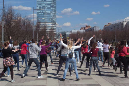 Street dance. A clear day, synchronized movements of performers and a good mood of the dancers and spectators themselves.の写真素材