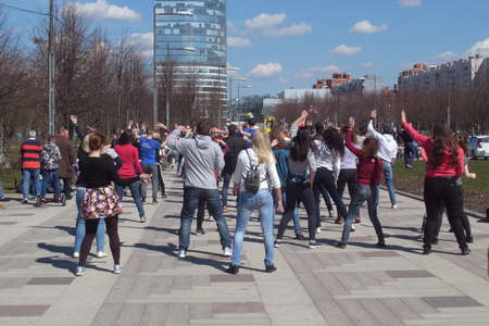 Street dance. A clear day, synchronized movements of performers and a good mood of the dancers and spectators themselves.の写真素材