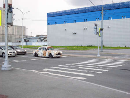 Newspaper-mobile, old car after tuning.のeditorial素材