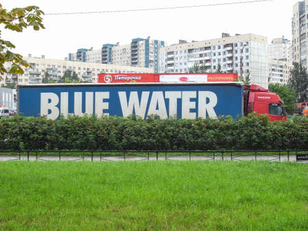 Blue water in the city. A truck with a van.のeditorial素材