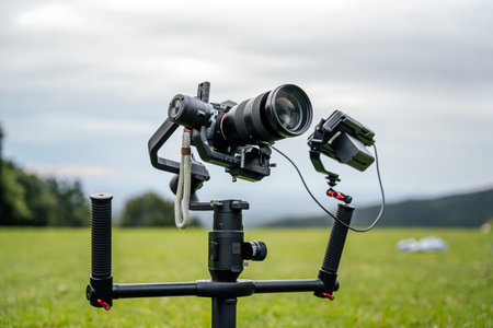 Camera in a professional video recording set planted on the ground, on top of a gimbal / stabilizer...