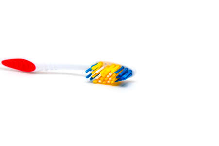The toothbrush lies on a white background. Brushing your teeth to keep them healthy. Two groups of...