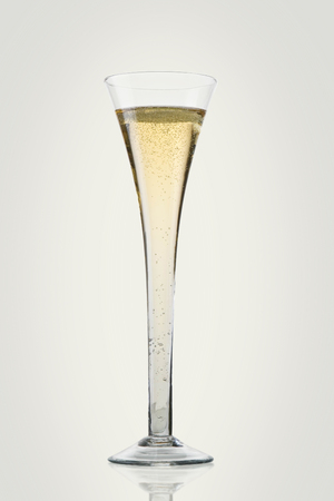 Champagne glass on yellow background.の写真素材
