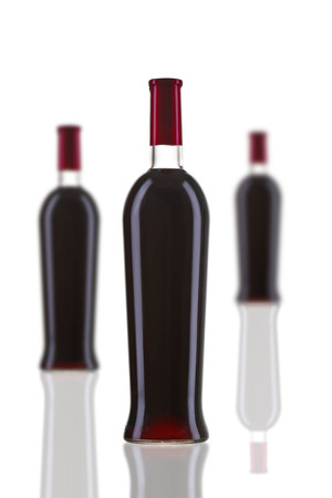 Bottles of red wine on white background. Perfect for bar and restaurantの写真素材