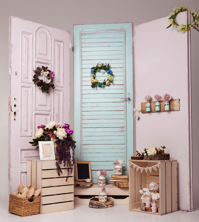 Interior decoration setup with flowers and picture frame.Pink doors,flowers.Great for wedding interiorの写真素材