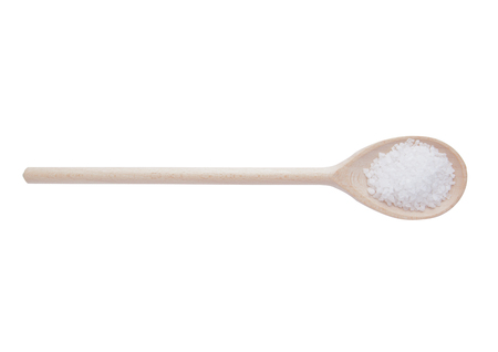 Salt on wooden spoon isolated on white background. Light wood colorの写真素材