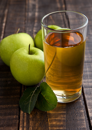 Apple juice glass with healthy green apples. Organic foodの写真素材