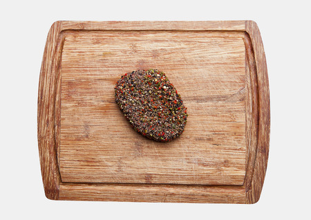 Beef raw steak on kitchen wooden board isolated on whiteの写真素材