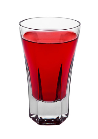 Red cocktail alcohol drink in elegant glass isolated on whiteの写真素材