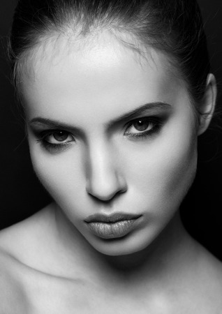 Beautiful woman model portrait black and white closeup . Black backgroundの写真素材