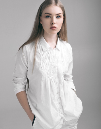 Beautiful young girl woman in white clothing  and long hairの写真素材