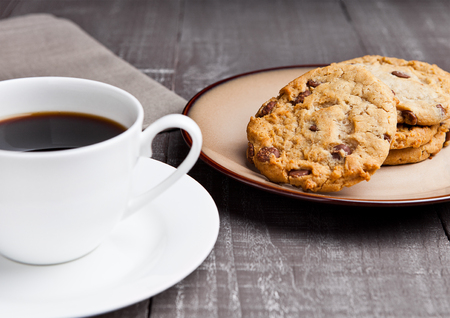 coffee cup with cookie for breakfast morning in cafeの写真素材