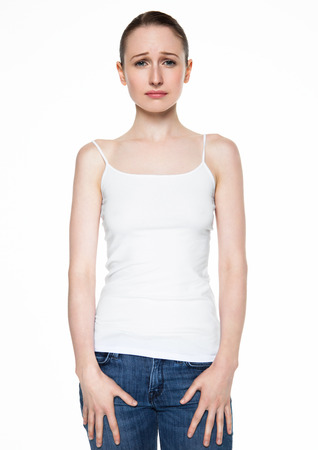 Young woman sad and crying having problem on white backgroundの写真素材