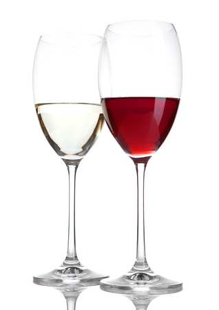 Glass of red and white wine with reflection on white backgroundの写真素材