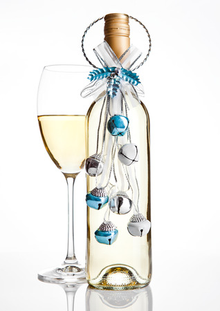 Bottle and glass white wine christmas decoration on white backgroundの写真素材