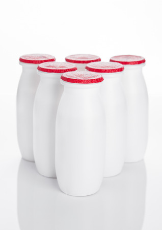 Yogurt containers healthy vitamin drink on white backgroundの写真素材