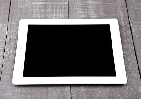 Graphic tablet computer pc gadget on wooden table blank