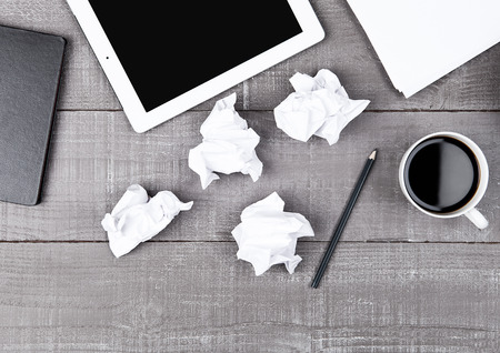 Graphic tablet with paper coffee cup and pencil on office deskの写真素材