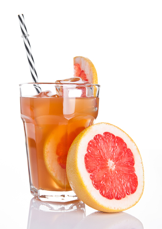 Glass of healthy grapefruit  juice with fruit on wooden backgroundの写真素材