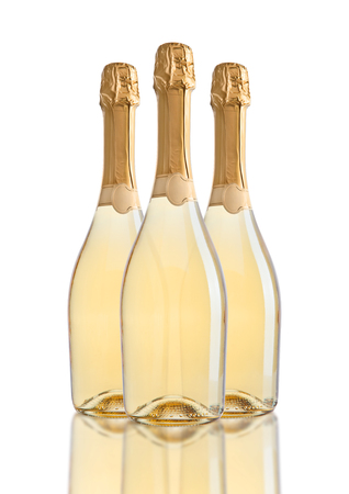 Bottles of champagne golden yellow color on white backgroundの写真素材