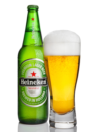LONDON,UK -OCTOBER 23, 2016: Bottle of Heineken Lager Beer with glass on white background. Heineken is the flagship product of Heineken Internationalのeditorial素材