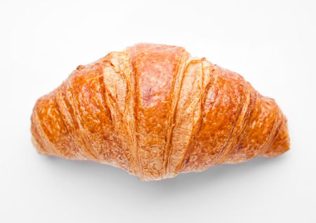 Fresh crispy croissant for breakfast on white backgroundの写真素材