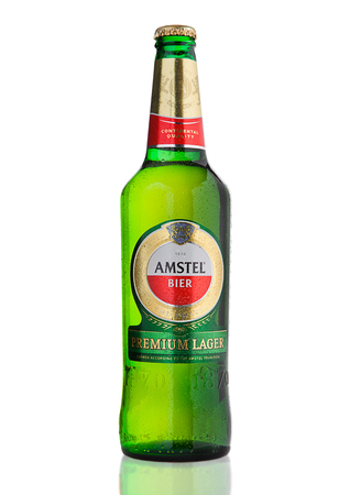 LONDON, UNITED KINGDOM - NOVEMBER 01, 2016: Cold bottle of Amstel Premium Lager on white background.Amstel is an internationally known brand of beer produced by Heineken International in Zoeterwoude, Netherlands.のeditorial素材