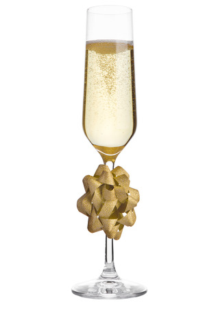 Glass of champagne with christmas decoration gift on white isolatedの写真素材