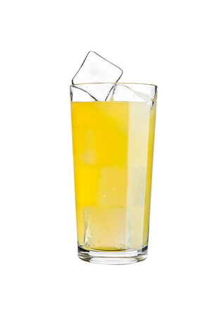 Glass of orange soda drink cold with ice cubes on white backgroundの写真素材