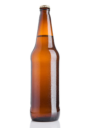 Brown beer bottle cold with frost on white background with reflectionの写真素材