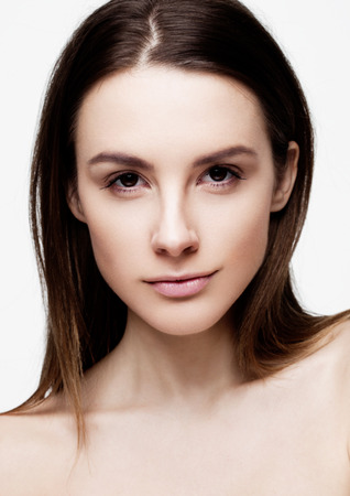 Beautiful woman girl with natural healthy makeup on white backgroundの写真素材