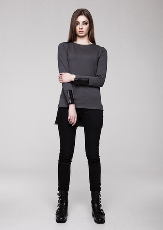 Beautiful young girl wearing shirt fashion on grey backgroundの写真素材