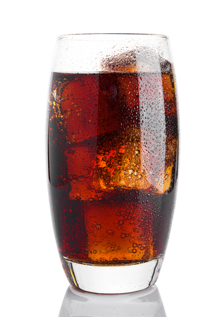 Glass of cold cola soda drink with ice cubes on white backgroundの写真素材
