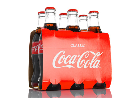 LONDON, UK - NOVEMBER 07, 2016: Classic bottles Of Coca-Cola six pack on white backgroundのeditorial素材