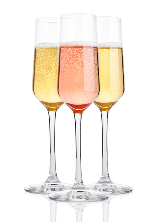 Glasses of champagne with bubbles on white backgroundの写真素材