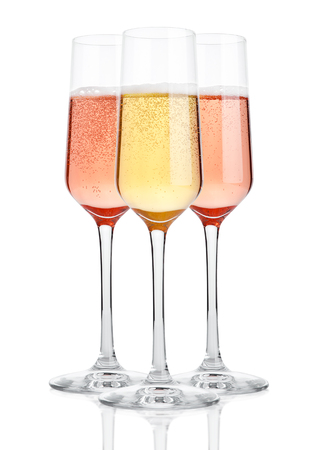 Glasses of champagne with bubbles on white backgroundの写真素材