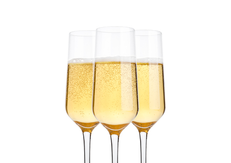 Glasses of champagne with bubbles on white backgroundの写真素材