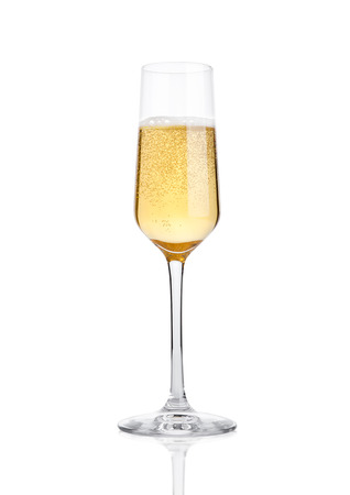 Glass of champagne with bubbles on white backgroundの写真素材