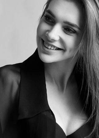 Portrait of beautiful woman girl with smile black and whiteの写真素材