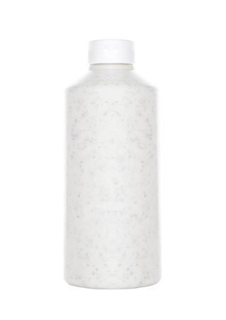 Mint cream sauce in plastic container on white backgroundの写真素材