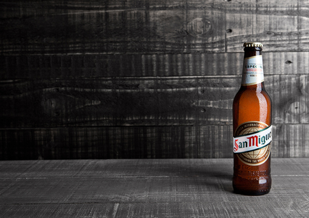 LONDON, UK- NOVEMBER 15 ,2016: Cold bottle of San Miguel beer. The San Miguel brand of beer is the leading brand of the San Miguel Brewery Inc, the largest beer producer in the Philippines.のeditorial素材
