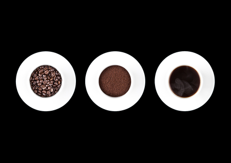 Cup of fresh coffee with cup of beans and powder on black background for cafeの写真素材
