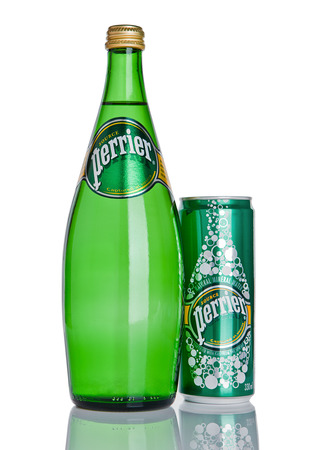 LONDON, UK - DECEMBER 06, 2016: Bottle and tin of Perrier sparkling water. Perrier is a French brand of natural bottled mineral water sold worldwide.のeditorial素材