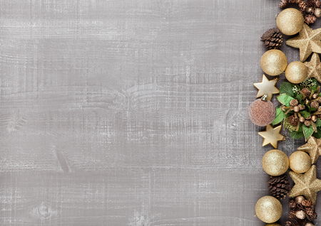 Christmas decoration yellow and green on wooden background.Toys.Stars.Ballsの写真素材