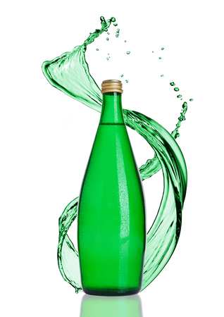 Bottle of sparkling healthy water with splashes on white backgroundの写真素材