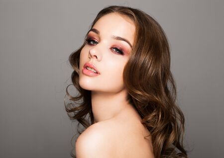 Beauty red eyes pink lips makeup fashion model on black backgroundの写真素材