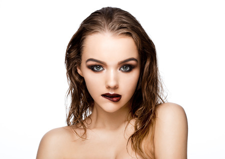Beauty smokey eyes red lips makeup wet hair sexy model on grey backgroundの写真素材